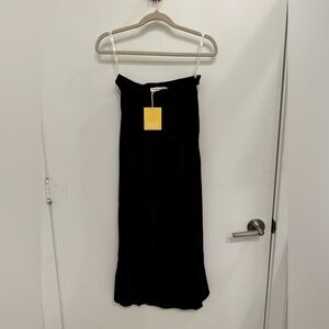 Brand new Charlie Holiday black midi skirt
(NWT).
